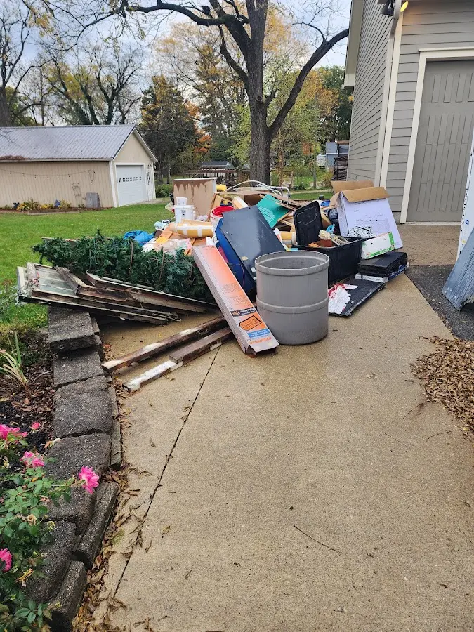 Dumpster being loaded with debris for 3 Yard Dumpster Rental in Boulder
